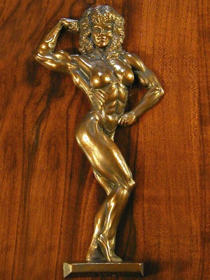 female single bicep plaque featuring a woman bodybuilder